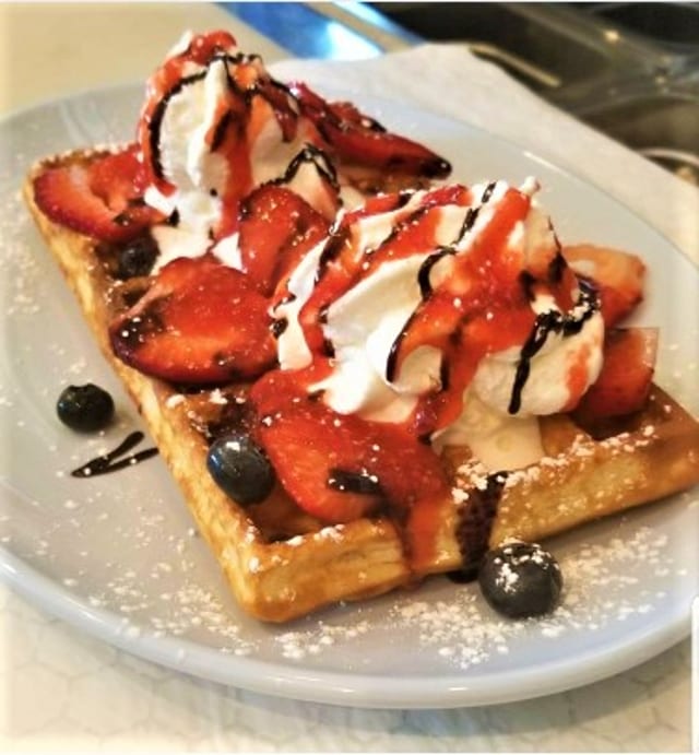 Waffles with Sauce, Fruits and Whipped Cream.